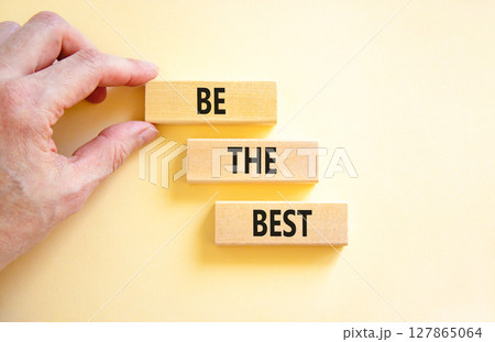 Motivational be the best symbol. Concept words Be the best on beautiful wooden blocks. Beautiful white background. Businessman hand. Business motivational be the best concept. Copy space. 127865064