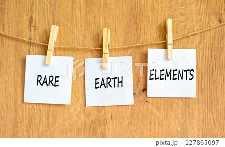 Rare earth elements symbol. Concept words Rare earth elements on beautiful white paper on wooden clothespin. Beautiful wooden background. Business and rare earth elements concept. Copy space. Rare earth elements symbol. Concept words Rare earth elements on beautiful white paper on wooden clothespin. Beautiful wooden background. Business and rare earth elements concept. Copy space. 127865097