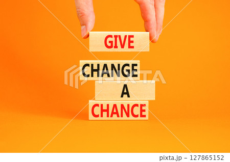 Give change a chance symbol. Concept words phrase Give change a chance on beautiful wooden blocks. Beautiful orange paper background Businessman's hand Business Give change a chance concept Copy space Give change a chance symbol. Concept words phrase Give change a chance on beautiful wooden blocks. Beautiful orange paper background Businessman's hand Business Give change a chance concept Copy space 127865152
