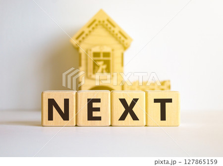 Next symbol. Concept word Next on beautiful wooden blocks. Beautiful white table white background. Wooden beautiful house. Business, lifestyle, support and next concept. Copy space. 127865159