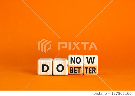 Do better and now symbol. Concept words Do better Do now on wooden block. Beautiful orange table orange background. Business do better and now concept. Copy space. Do better and now symbol. Concept words Do better Do now on wooden block. Beautiful orange table orange background. Business do better and now concept. Copy space. 127865160