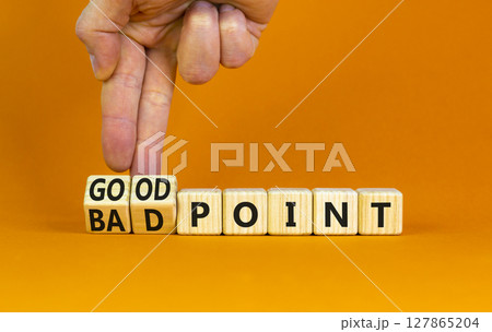Good or bad point symbol. Concept words Good point Bad point on beautiful wooden blocks. Beautiful orange table orange background. Businessman hand. Business good bad point concept. Copy space 127865204