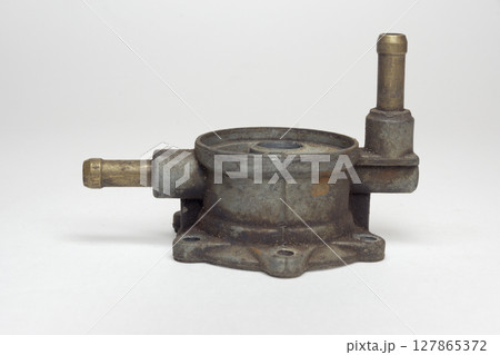 fuel pump upper body, with inlet and outlet brass pipes for fuel line, on white background, with clipping path 127865372