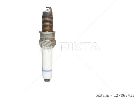 used spark plug, blue strip on body of white insulator, isolated on white background 127865415