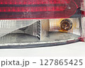 tail light of sedan body car. broken plastic lens. closeup on light bulbs 127865425