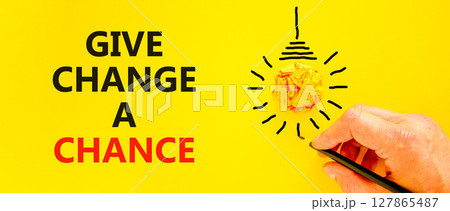 Give change a chance symbol. Concept words phrase Give change a chance on beautiful yellow paper. Businessman's hand. Beautiful yellow background. Business Give change a chance concept. Copy space. Give change a chance symbol. Concept words phrase Give change a chance on beautiful yellow paper. Businessman's hand. Beautiful yellow background. Business Give change a chance concept. Copy space. 127865487