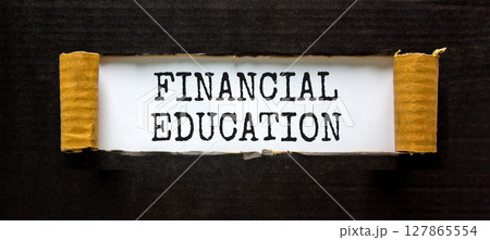 Financial education symbol. Concept words Financial education on beautiful white paper. Beautiful black paper background. Business Financial education concept. Copy space. 127865554
