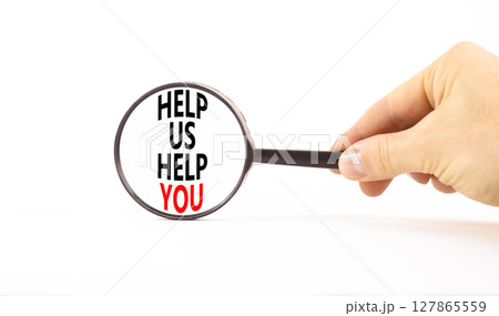Help you symbol. Concept words phrase Help us help you in beautiful black magnifying glass. Businessman's hand. Beautiful white background. Business Help you concept. Copy space. 127865559