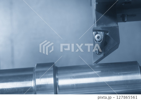 The CNC lathe machine forming cutting the metal shaft parts in the light blue scene. 127865561