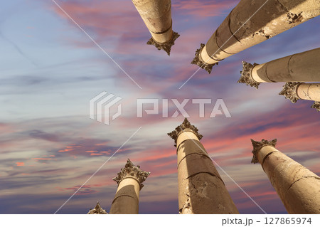 Roman Columns in the Jordanian city of Jerash (Gerasa of Antiquity), capital and largest city of Jerash Governorate, Jordan. Against the background of a beautiful sky with clouds Roman Columns in the Jordanian city of Jerash (Gerasa of Antiquity), capital and largest city of Jerash Governorate, Jordan. Against the background of a beautiful sky with clouds 127865974
