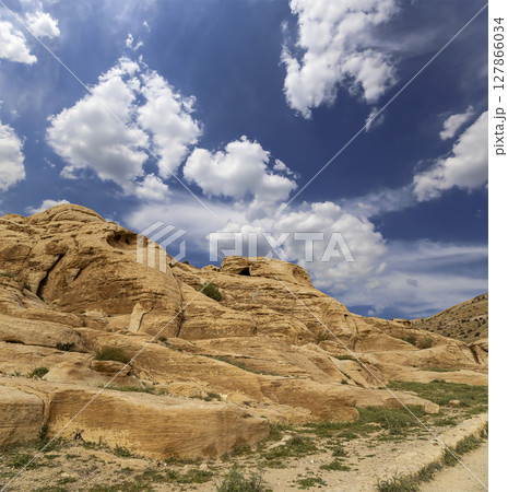 Mountains of Petra (against the background of a beautiful sky with clouds), Jordan, Middle East. Petra has been a UNESCO World Heritage Site since 1985 Mountains of Petra (against the background of a beautiful sky with clouds), Jordan, Middle East. Petra has been a UNESCO World Heritage Site since 1985 127866034