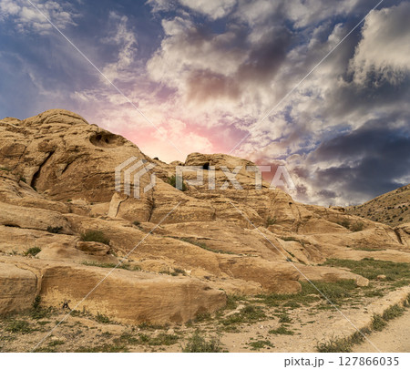 Mountains of Petra (against the background of a beautiful sky with clouds), Jordan, Middle East. Petra has been a UNESCO World Heritage Site since 1985 127866035