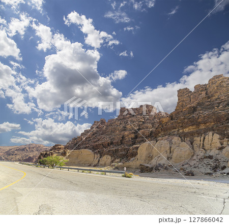 Mountains of Petra (against the background of a beautiful sky with clouds), Jordan, Middle East. Petra has been a UNESCO World Heritage Site since 1985 Mountains of Petra (against the background of a beautiful sky with clouds), Jordan, Middle East. Petra has been a UNESCO World Heritage Site since 1985 127866042