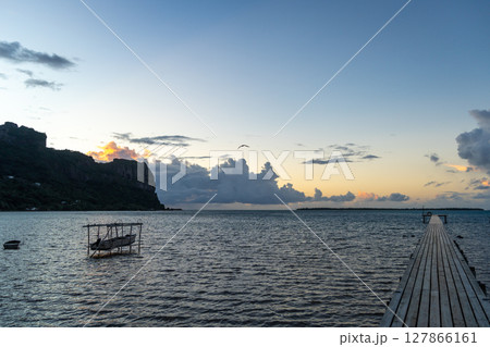 Sunset over the tranquil lagoon of Maupiti, French Polynesia 127866161