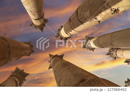Roman Columns in the Jordanian city of Jerash (Gerasa of Antiquity), capital and largest city of Jerash Governorate, Jordan. Against the background of a beautiful sky with clouds 127866402