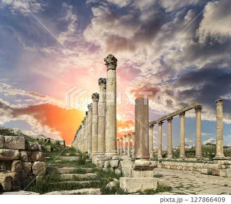 Roman Columns in the Jordanian city of Jerash (Gerasa of Antiquity), capital and largest city of Jerash Governorate, Jordan. Against the background of a beautiful sky with clouds Roman Columns in the Jordanian city of Jerash (Gerasa of Antiquity), capital and largest city of Jerash Governorate, Jordan. Against the background of a beautiful sky with clouds 127866409