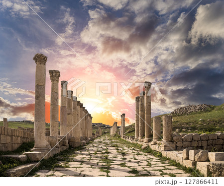 Roman Columns in the Jordanian city of Jerash (Gerasa of Antiquity), capital and largest city of Jerash Governorate, Jordan. Against the background of a beautiful sky with clouds Roman Columns in the Jordanian city of Jerash (Gerasa of Antiquity), capital and largest city of Jerash Governorate, Jordan. Against the background of a beautiful sky with clouds 127866411