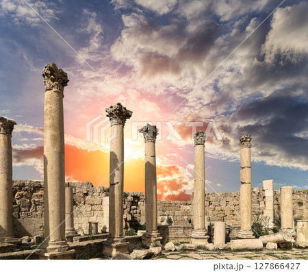Roman Columns in the Jordanian city of Jerash (Gerasa of Antiquity), capital and largest city of Jerash Governorate, Jordan. Against the background of a beautiful sky with clouds Roman Columns in the Jordanian city of Jerash (Gerasa of Antiquity), capital and largest city of Jerash Governorate, Jordan. Against the background of a beautiful sky with clouds 127866427
