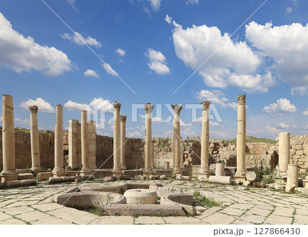 Roman Columns in the Jordanian city of Jerash (Gerasa of Antiquity), capital and largest city of Jerash Governorate, Jordan. Against the background of a beautiful sky with clouds Roman Columns in the Jordanian city of Jerash (Gerasa of Antiquity), capital and largest city of Jerash Governorate, Jordan. Against the background of a beautiful sky with clouds 127866430