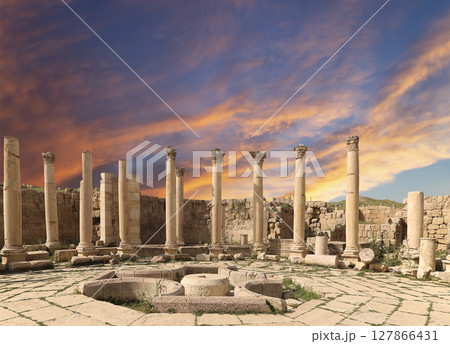 Roman Columns in the Jordanian city of Jerash (Gerasa of Antiquity), capital and largest city of Jerash Governorate, Jordan. Against the background of a beautiful sky with clouds Roman Columns in the Jordanian city of Jerash (Gerasa of Antiquity), capital and largest city of Jerash Governorate, Jordan. Against the background of a beautiful sky with clouds 127866431