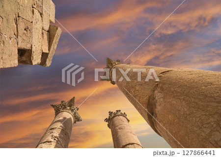 Roman Columns in the Jordanian city of Jerash (Gerasa of Antiquity), capital and largest city of Jerash Governorate, Jordan. Against the background of a beautiful sky with clouds Roman Columns in the Jordanian city of Jerash (Gerasa of Antiquity), capital and largest city of Jerash Governorate, Jordan. Against the background of a beautiful sky with clouds 127866441