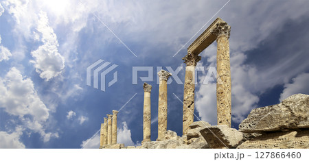 Roman Columns in the Jordanian city of Jerash (Gerasa of Antiquity), capital and largest city of Jerash Governorate, Jordan. Against the background of a beautiful sky with clouds Roman Columns in the Jordanian city of Jerash (Gerasa of Antiquity), capital and largest city of Jerash Governorate, Jordan. Against the background of a beautiful sky with clouds 127866460