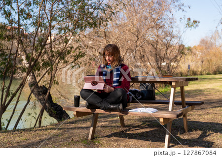 Remote Work in Nature. A Peaceful Outdoor Workspace by the River Remote Work in Nature. A Peaceful Outdoor Workspace by the River 127867084