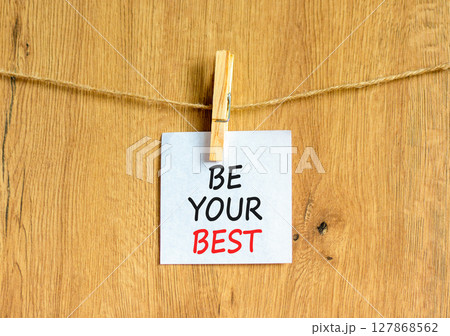 Motivational be your best symbol. Concept words Be your best on beautiful white paper on clothespin. Beautiful wooden background. Business motivational be your best concept. Copy space. 127868562