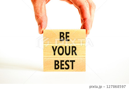 Motivational be your best symbol. Concept words Be your best on beautiful wooden blocks. Beautiful white background. Businessman hand. Business motivational be your best concept. Copy space. Motivational be your best symbol. Concept words Be your best on beautiful wooden blocks. Beautiful white background. Businessman hand. Business motivational be your best concept. Copy space. 127868597