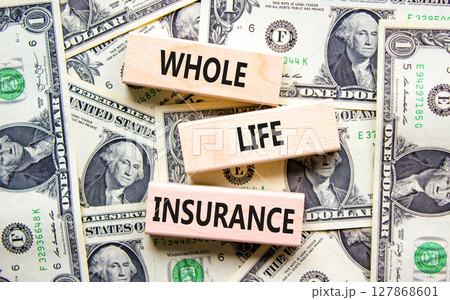 Whole life insurance symbol. Concept words Whole life insurance on beautiful wooden blocks. Dollar bills. Beautiful background from dollar bills. Business whole life insurance concept. Copy space. 127868601