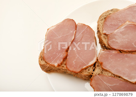 Ham sandwiches. Ham cut into thin slices. 127869879