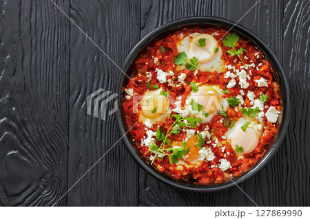 shakshuka, eggs poached in tomato vegetable sauce shakshuka, eggs poached in tomato vegetable sauce 127869990