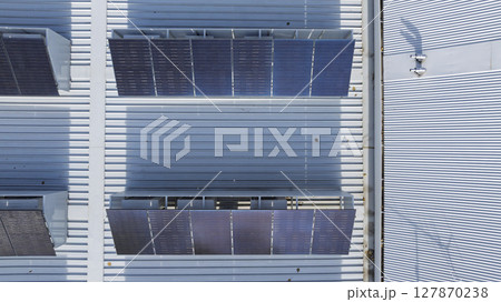 Solar Panels on the roof of a commercial building 127870238
