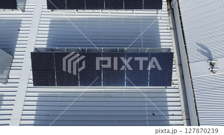 Solar Panels on the roof of a commercial building Solar Panels on the roof of a commercial building 127870239