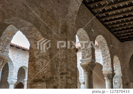 Euphrasian basilica ancient stone arches in Porec, Croatia. Euphrasian basilica ancient stone arches in Porec, Croatia. 127870433