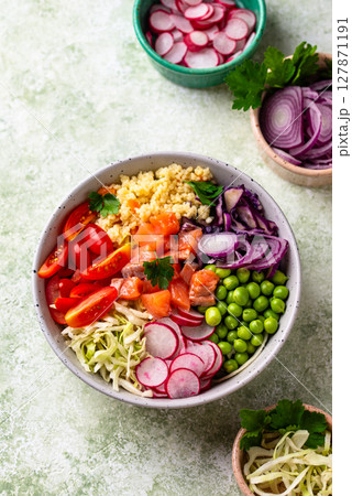 Balanced healthy bowl with vegetables and salmon 127871191
