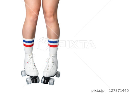 Female caucasian legs in roller skates and striped socks on white background Female caucasian legs in roller skates and striped socks on white background 127871440