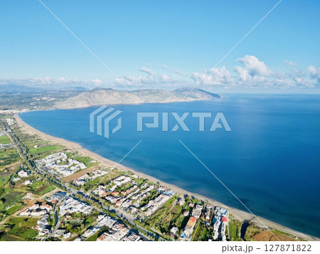 Cretan spring. View of turquoise sea and green fields 127871822