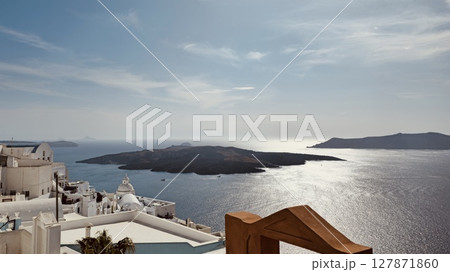 Santorini, Fira. View from the balcony overlooking the sea and nearby islands 127871860