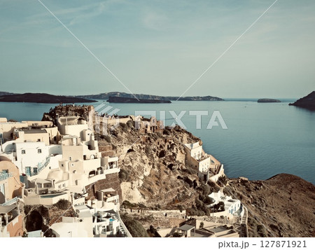 Santorini, the town of Oia, view of the town, cliffs, sea, and nearby islands Santorini, the town of Oia, view of the town, cliffs, sea, and nearby islands 127871921