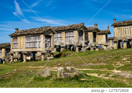 The communitarian granaries, called espigueiros, in the village of Lindoso, Peneda National Park, Northern Portugal 127872608