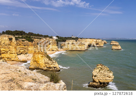 Praia da Marinha Beach among rock islets and cliffs seen from Seven Hanging Valleys Trail, Algarve, Portugal 127872618