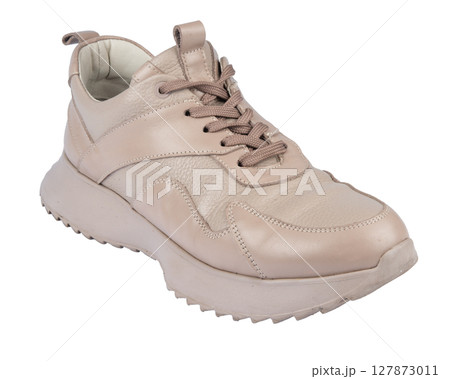 Women's leather sneakers isolated on white background. Women's leather sneakers isolated on white background. 127873011