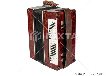Small retro bayan (accordion). Folk musical instrument. 127873035