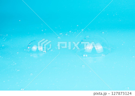 Abstract Beautiful Transparent Blue Soap Bubbles Background. Floating Bubbles Colorful. Soap Sud Bubbles Water. 127873124