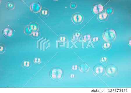 Abstract Beautiful Transparent Blue Soap Bubbles Background. Floating Bubbles Colorful. Soap Sud Bubbles Water. 127873125