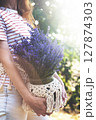 girl holding a bucket of lavender 127874303