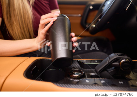 A Stylish Drink Container Perfect for Use in a Modern Car Interior, Both Functional and Fashionable A Stylish Drink Container Perfect for Use in a Modern Car Interior, Both Functional and Fashionable 127874760