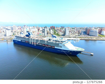 初夏の北海道函館市函館港に寄港するクルーズ船セレブリティミレニアム号の風景を空撮 初夏の北海道函館市函館港に寄港するクルーズ船セレブリティミレニアム号の風景を空撮 127875266