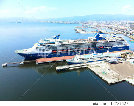初夏の北海道函館市函館港に寄港するクルーズ船セレブリティミレニアム号の風景を空撮 初夏の北海道函館市函館港に寄港するクルーズ船セレブリティミレニアム号の風景を空撮 127875270